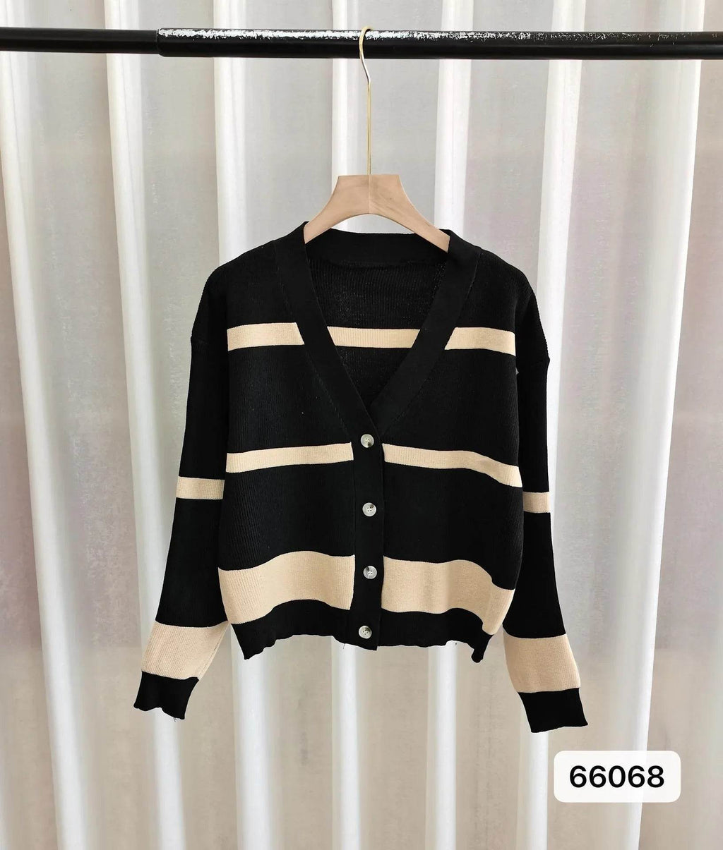 Black and beige striped V-neck cardigan with buttons, hanging on hanger for women's fashion