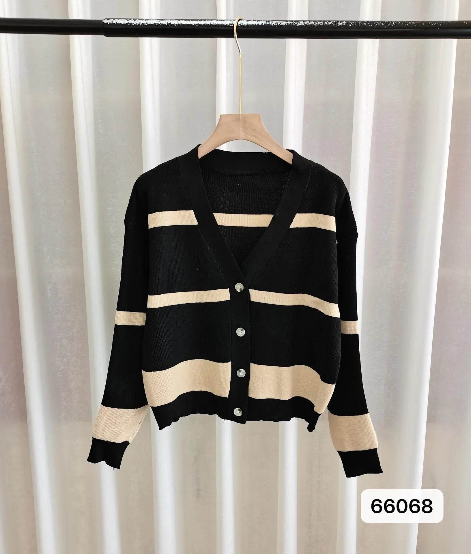 Black and beige striped V-neck cardigan with buttons, hanging on hanger for women's fashion