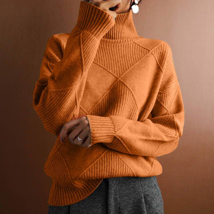 Cozy orange turtleneck sweater with diamond knit pattern, styled for everyday elegance and comfort.