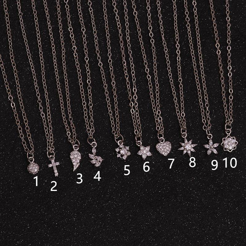10 delicate pendant necklaces with crystal charms — heart, star, cross, flower — perfect for everyday elegance