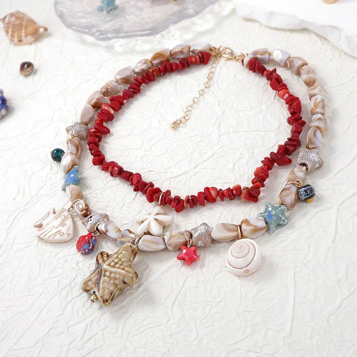 Red coral and shell bead necklace with starfish and seashell charms for beach style women's jewelry
