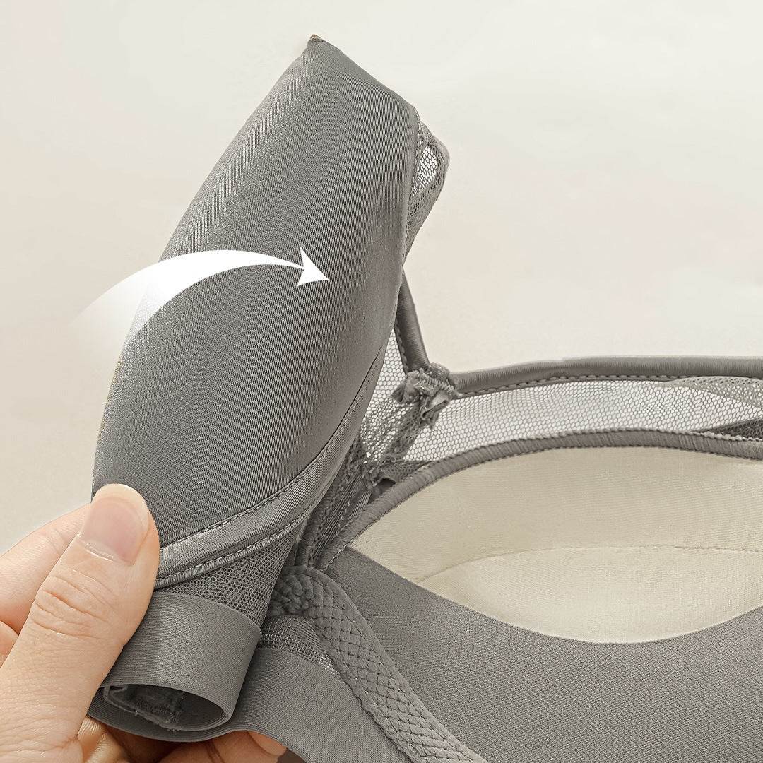 Gray seamless bra with mesh detailing and adjustable strap for comfort and support
