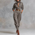Gray linen jumpsuit with belt, scarf, and brown boots for women's everyday elegance