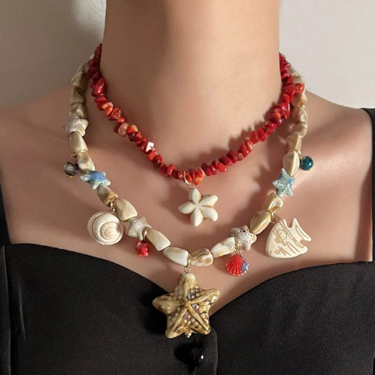 Layered beach-themed necklace with starfish, shells, and coral beads for women's summer style
