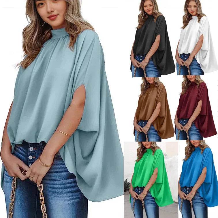 Women's flowy poncho top in multiple colors, paired with jeans and chain bag for casual elegance