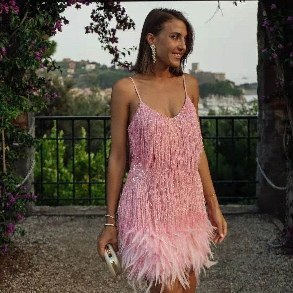 Pink sequin fringe dress with feather hem, perfect for evening events and elegant occasions
