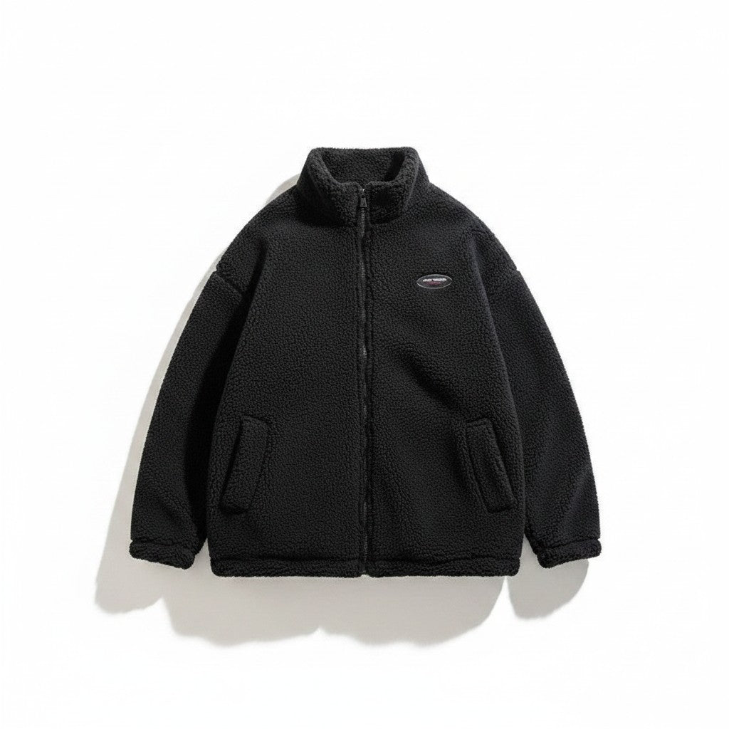 Laylace black double-sided lambswool winter coat with a high collar, zip-up front, and textured fleece material.