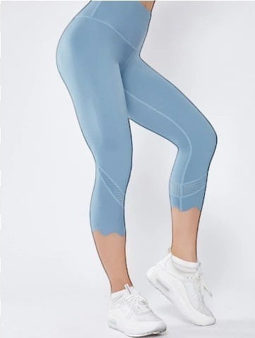 Laylace light blue high-waisted cropped leggings with laser-cut mesh calf detailing and a scalloped hem.