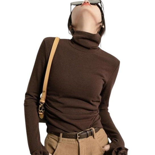 Laylace brown long sleeve turtleneck top with 3D rose floral cuffs worn by a woman with sunglasses