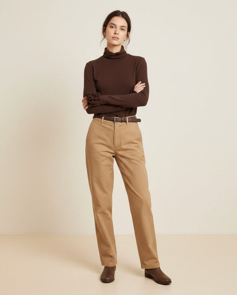 Laylace brown long sleeve turtleneck with 3D rose cuff detail worn by a model with beige trousers and brown boots