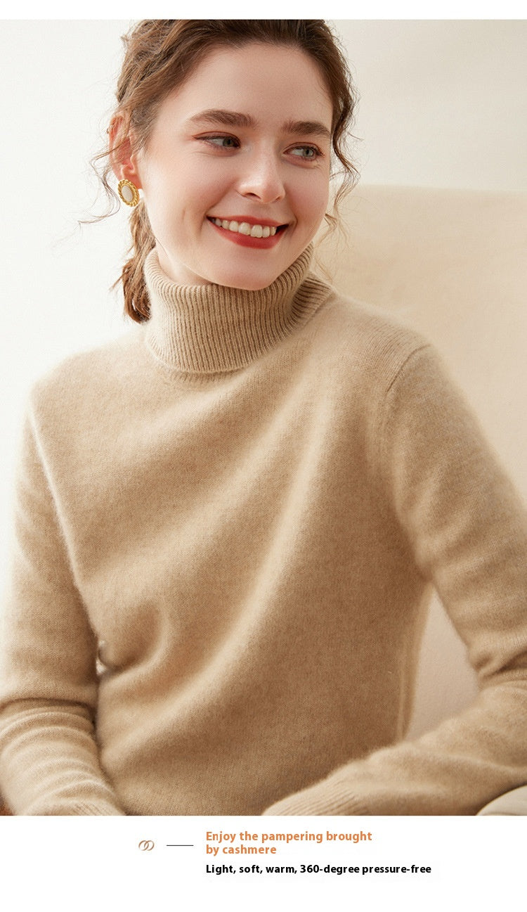 A woman wearing a Laylace thick camel cashmere turtleneck sweater with a soft knit texture.