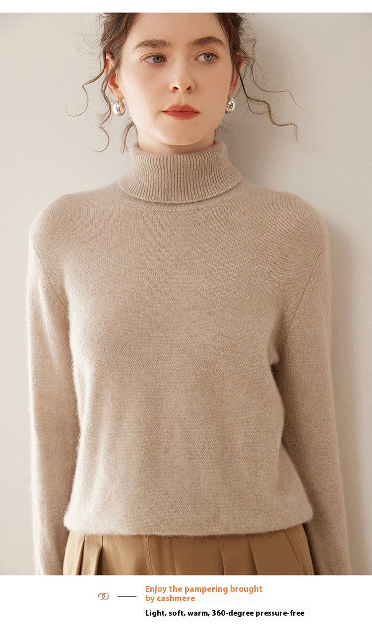 A model wearing a Laylace camel cashmere turtleneck sweater with a thick knit and long sleeves.