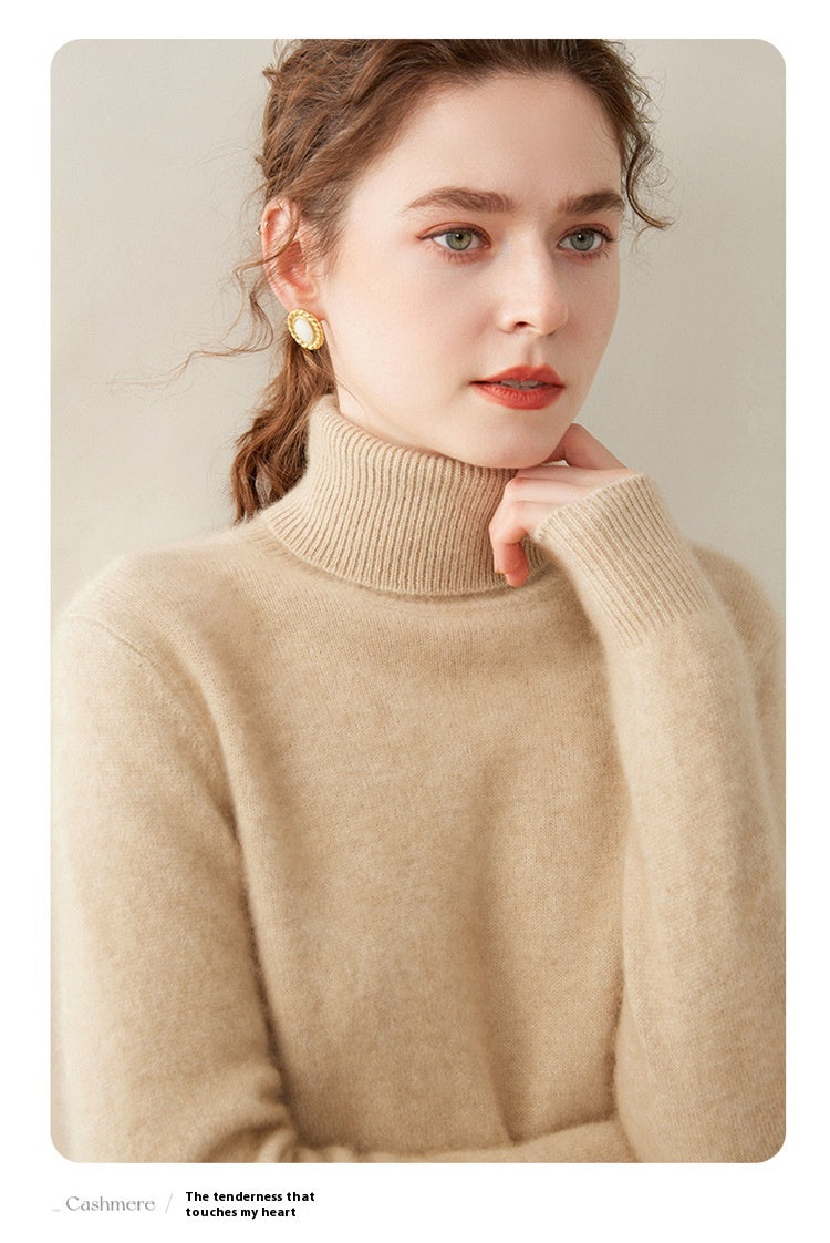 Woman wearing a Laylace thick camel cashmere turtleneck sweater with a cozy ribbed high neckline
