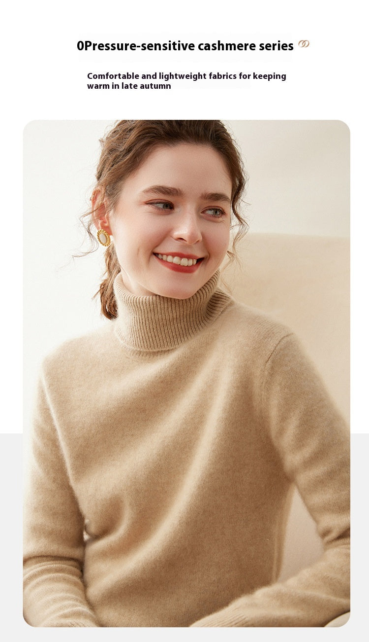 A woman wearing a Laylace thick camel cashmere turtleneck sweater with a soft knit texture and elegant high neckline.