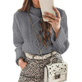Laylace grey long-sleeve knit sweater with round neck and cable knit texture worn by a woman with a leopard skirt