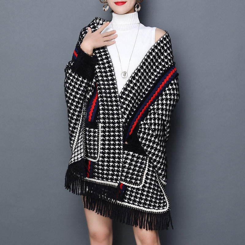 Laylace red black and white houndstooth imitation mink shawl cardigan with tassel trim worn over a white turtleneck