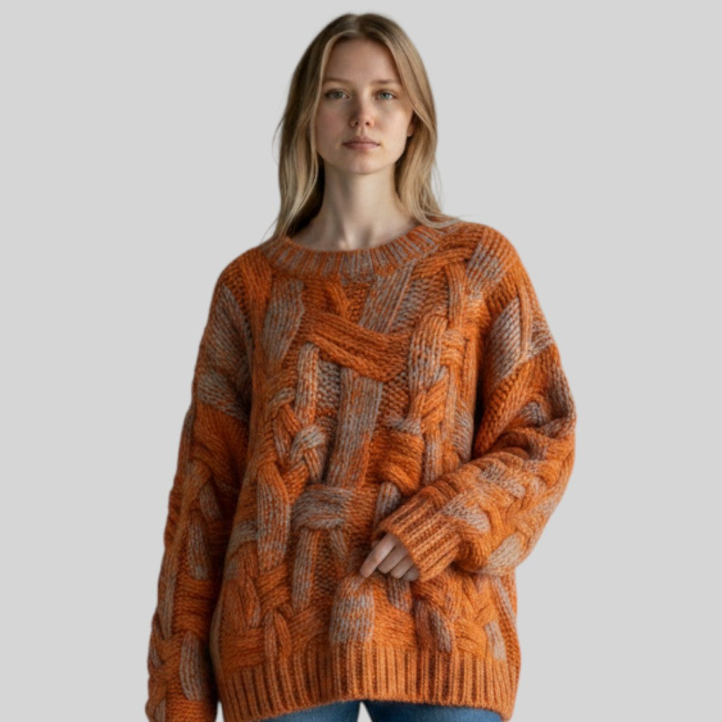 Laylace loose fit woolen sweater in orange and grey with a geometric cable knit pattern worn by a blonde model