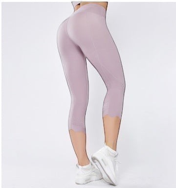 Laylace high-waisted athletic cropped leggings in light purple with a scalloped hem and laser-cut mesh calf detail.