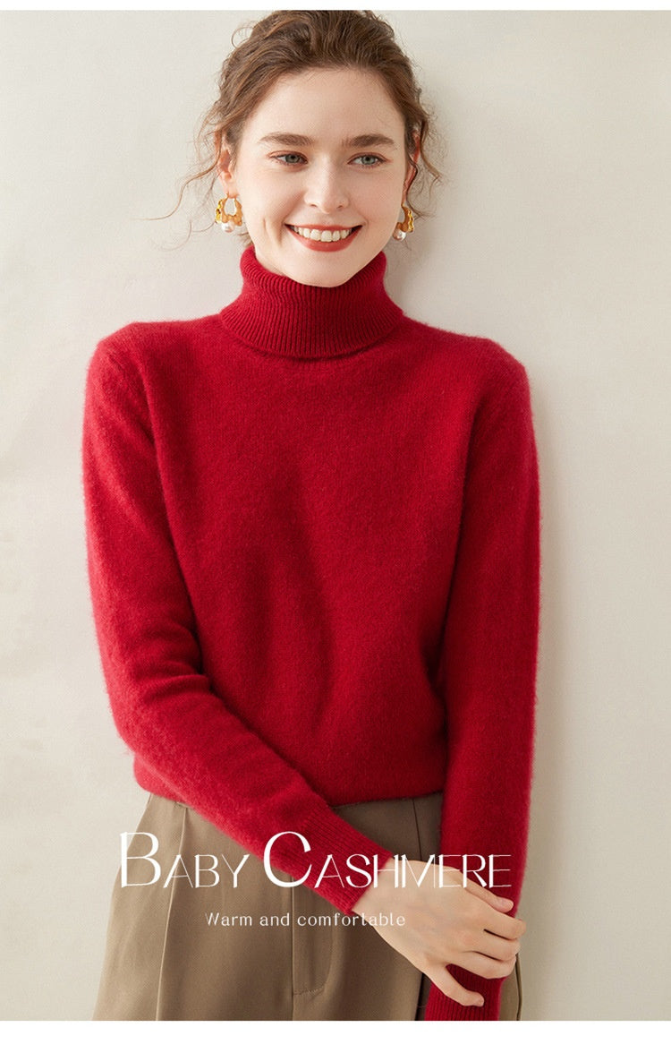A woman wearing a Laylace ruby red thick cashmere turtleneck sweater with long sleeves and a cozy knit texture.