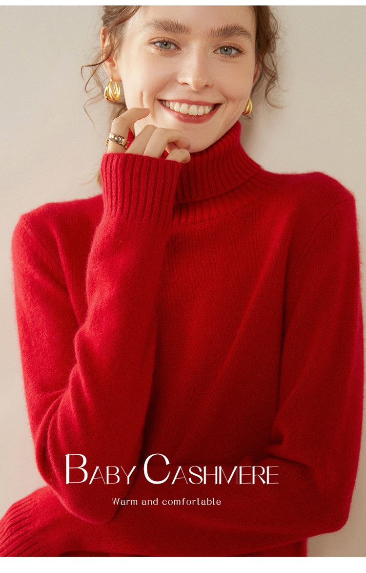 A woman wearing a vibrant red Laylace thick cashmere turtleneck sweater with long sleeves and a cozy ribbed collar.