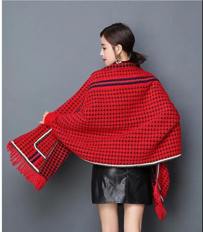 Laylace red and black houndstooth imitation mink shawl with tassel trim worn by a woman