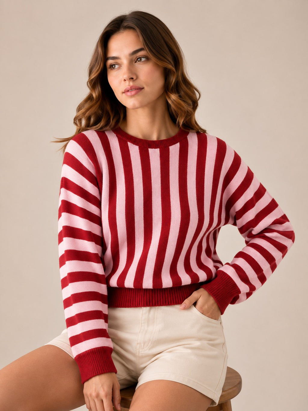 Laylace women's red and pink striped long-sleeve knit pullover sweater worn with light-colored shorts