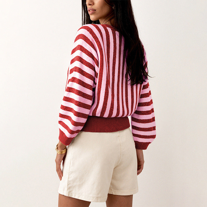 Laylace long-sleeve knit pullover featuring a red and pink vertical striped pattern and ribbed hem
