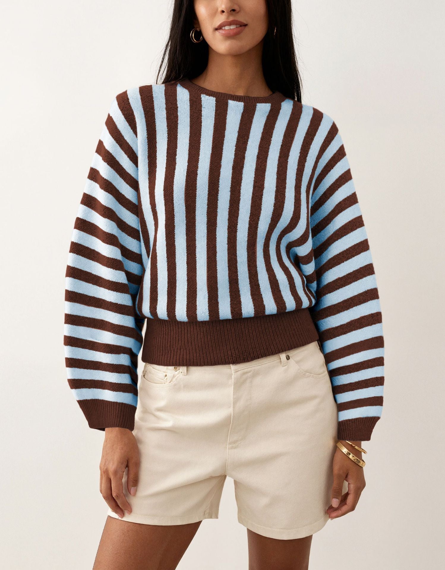 Laylace long-sleeve knit pullover featuring vertical brown and light blue stripes with a ribbed hem and cuffs