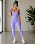 Purple sleeveless ribbed jumpsuit styled with white sneakers