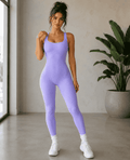 Purple sleeveless ribbed jumpsuit styled with white sneakers
