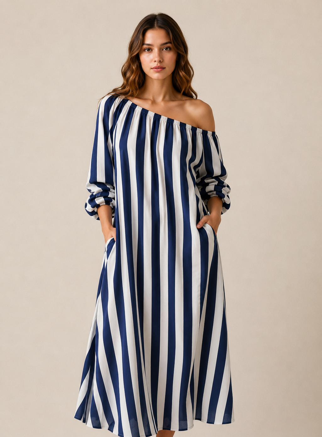 A woman modeling an off-the-shoulder midi dress with vertical navy blue and white stripes, set against a plain beige studio background.